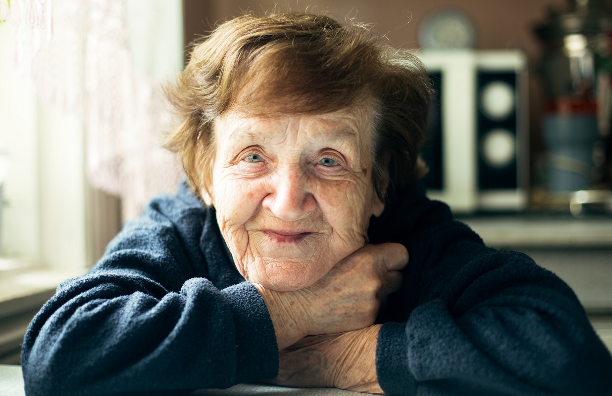 Portrait of a happy older woman in her home.